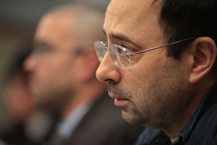 A closeup of Larry Nassar wearing glasses.