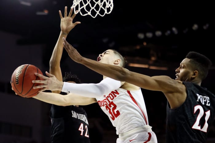 Rob Gray driving to the basket for Houston.