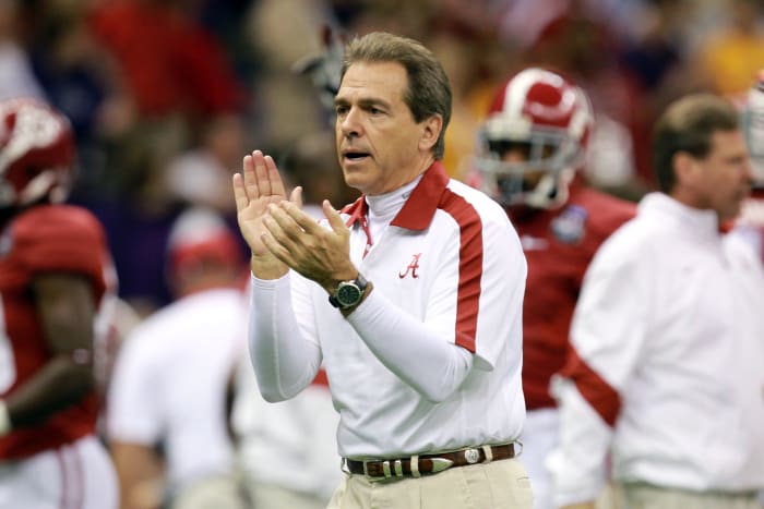 Head coach Nick Saban of the Alabama Crimson Tide takes the field before playing against the Louisiana State University Tigers.