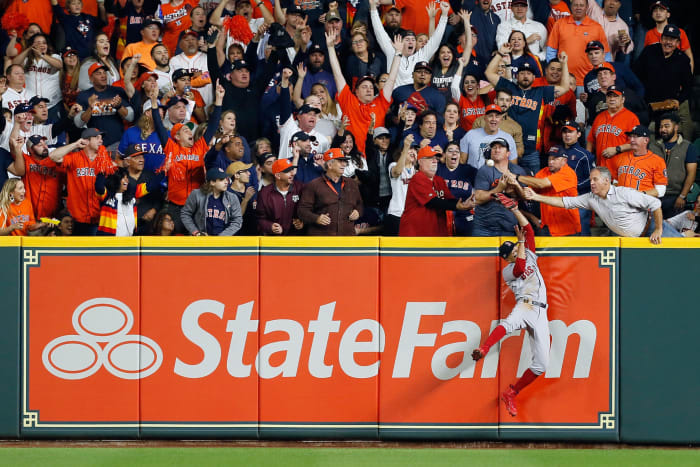 Mookie Betts leaps for a catch.