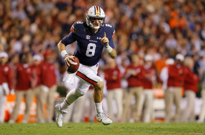 Auburn's Jarrett Stidham runs the ball down the field.