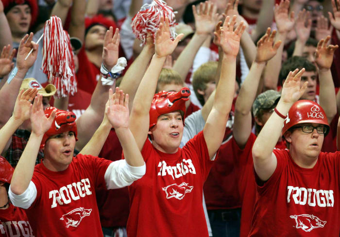 Arkansas basketball fan wearing Razorbacks hats.