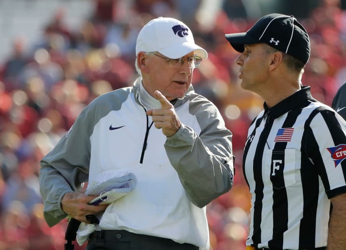 Bill Snyder talks with an official.