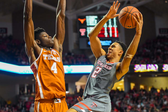 Mo Bamba defending a Texas Tech player's shot.