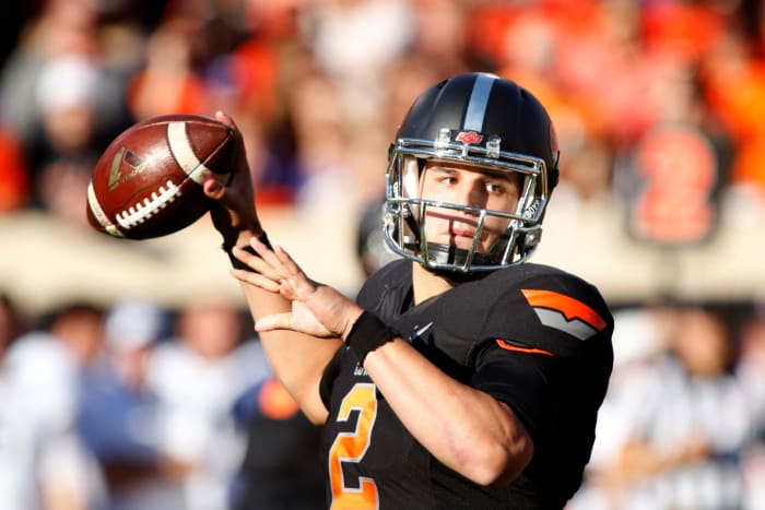 Mason Rudolph drops back to throw a pass.