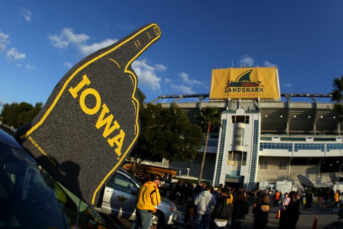 Iowa fan sports a foam finger.