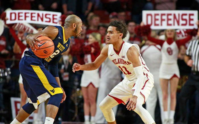 Trae Young guarding Jevon Carter in a game between Oklahoma and West Virginia.