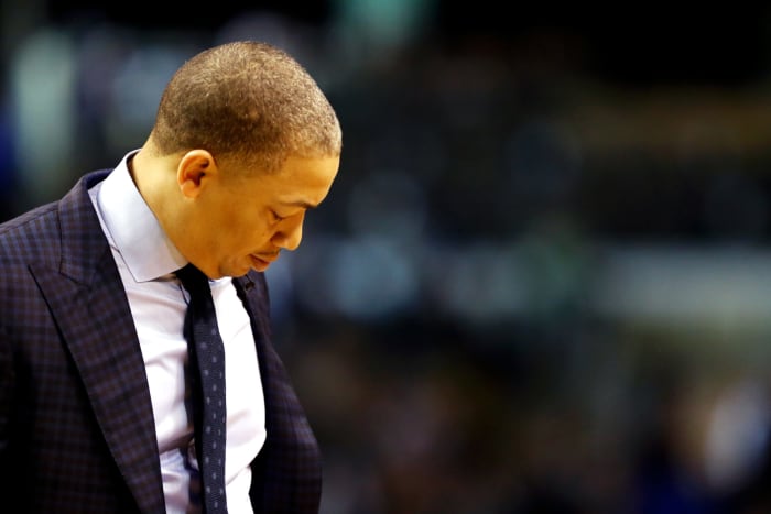 A closeup of Tyronn Lue looking down.