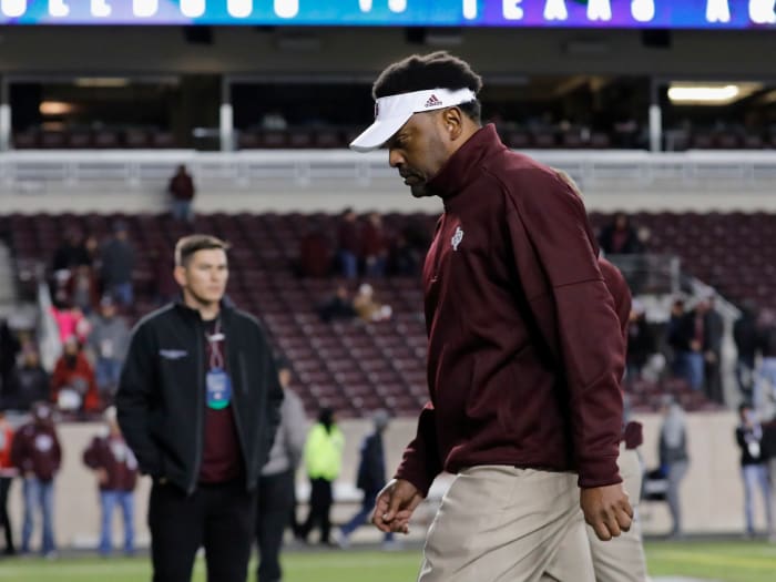 A closeup of Kevin Sumlin walking off the field.