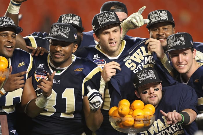 georgia tech players celebrate their win in the orange bowl