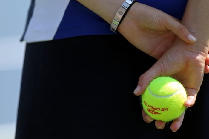 A generic picture of someone holding a tennis ball