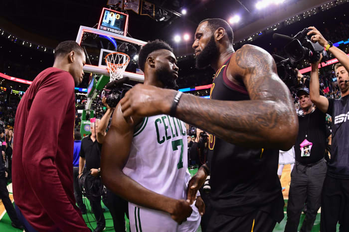Jaylen Brown hugs LeBron James after a game.
