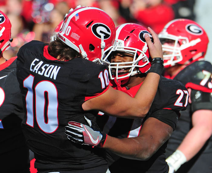 Jacob Eason and Nick Chubb celebrating.