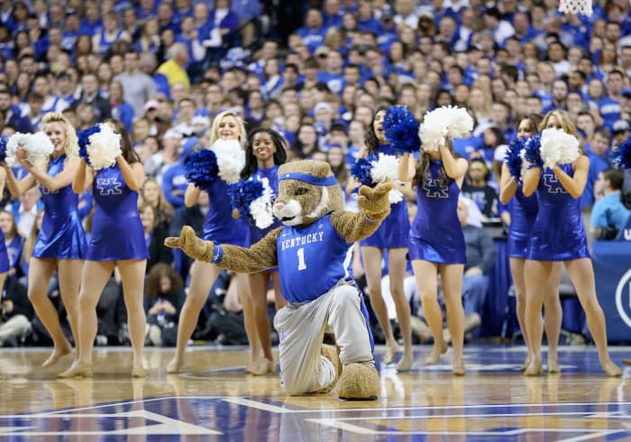 Kentucky's mascot wearing a blue Kentucky jersey while performing with the cheerleaders.