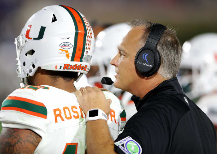 Mark Richt gives instruction to quarterback Malik Rosier.