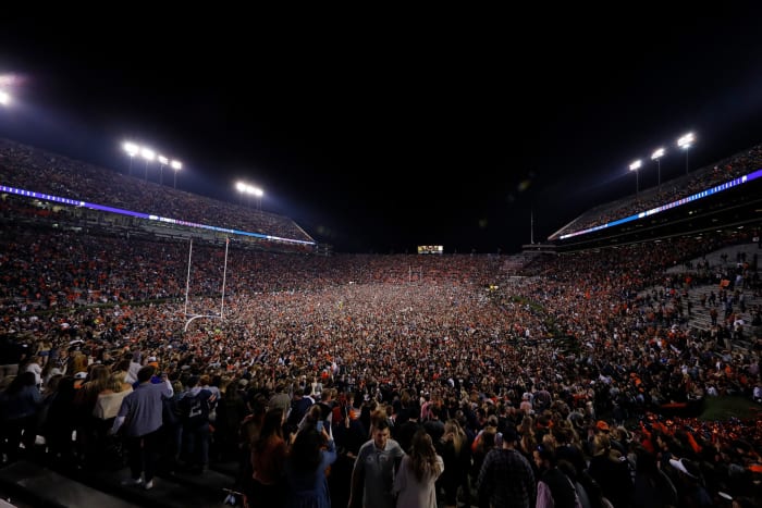 Auburn fans storm the field after beating Alabama.