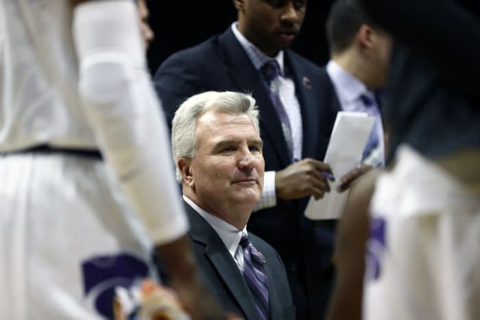 Bruce Weber talks to his team.