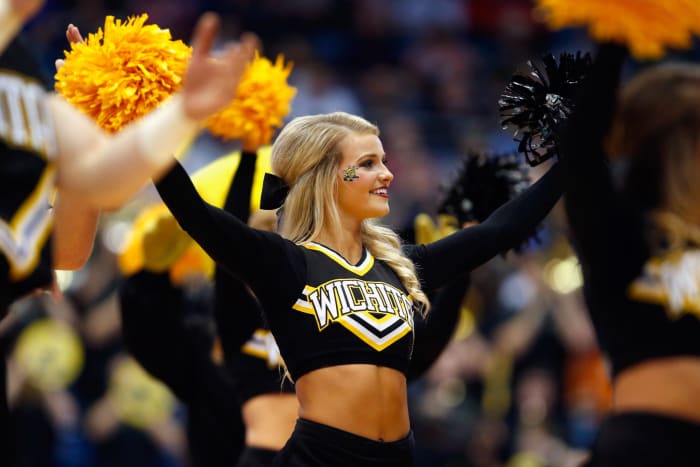 Wichita State cheerleader holding pompoms.