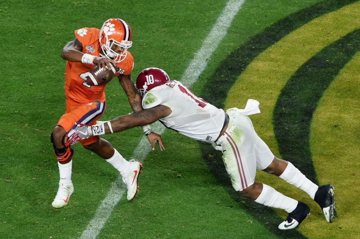 Deshaun Watson shedding Reuben Foster's tackle.