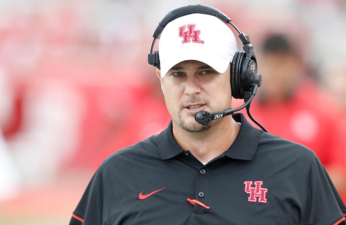 Houston coach Tom Herman walking on the sidelines.