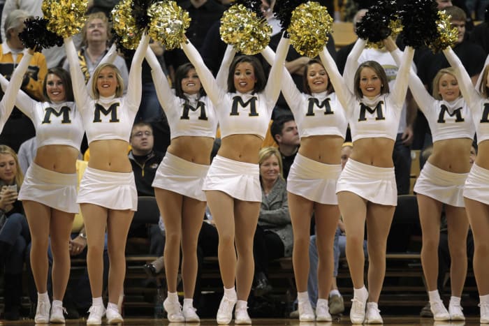 Missouri's cheerleaders holding pompoms.