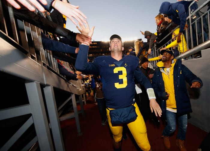 Wilton Speight of the Michigan Wolverines leaves the field after a 41-8 win over the Illinois Fighting Illini.