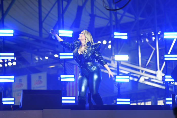 Bebe Rexha performs at halftime on Thanksgiving.