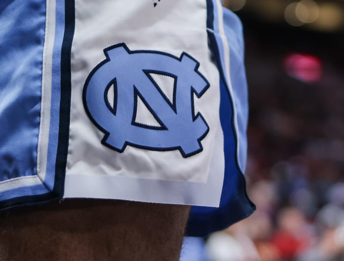 A closeup image of the North Carolina logo on a pair of shorts.