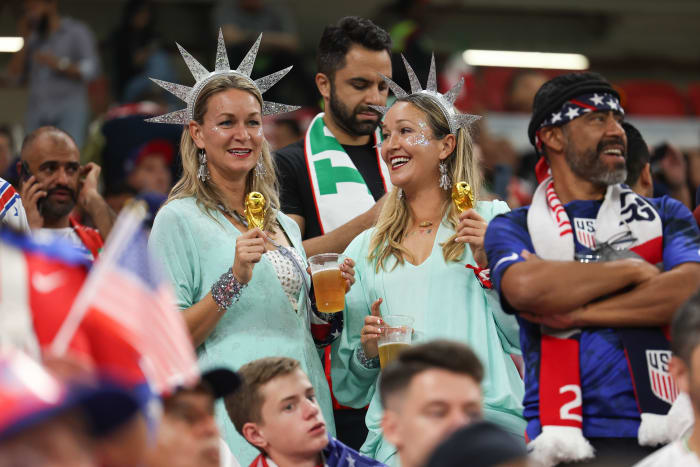 DOHA, QATAR - NOVEMBER 29: Two female fans of USA dressed up as the Statue of Liberty and holding replica World Cup trophies before the FIFA World Cup Qatar 2022 Group B match between IR Iran and USA at Al Thumama Stadium on November 29, 2022 in Doha, Qatar. (Photo by Matthew Ashton - AMA/Getty Images)