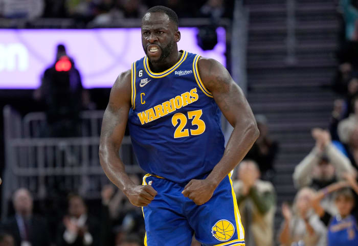 SAN FRANCISCO, CALIFORNIA - DECEMBER 10: Draymond Green #23 of the Golden State Warriors reacts after Jonathan Kuminga #00 slam dunked over Jayson Tatum #0 of the Boston Celtics during the fourth quarter of an NBA basketball game at Chase Center on December 10, 2022 in San Francisco, California. NOTE TO USER: User expressly acknowledges and agrees that, by downloading and or using this photograph, User is consenting to the terms and conditions of the Getty Images License Agreement. (Photo by Thearon W. Henderson/Getty Images)