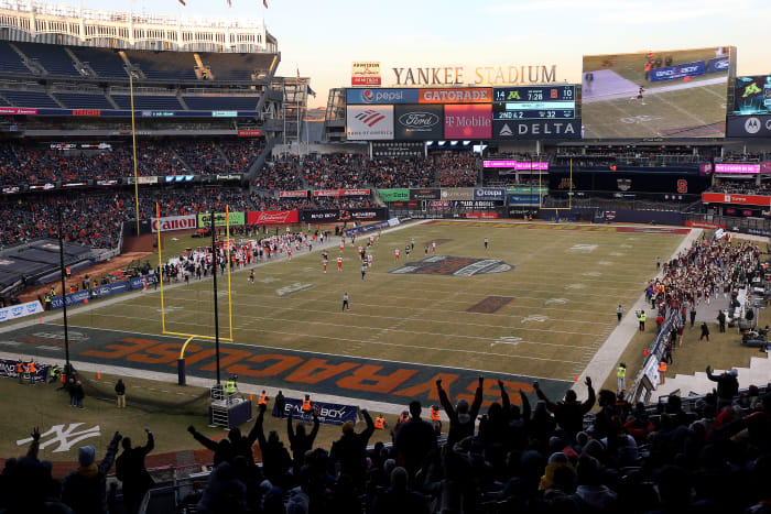 Yankee Stadium hosting the Pinstripe Bowl.
