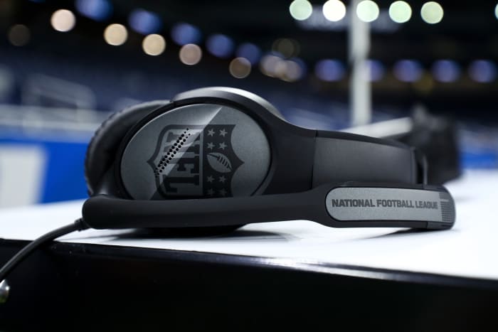 A coach's headset on the sidelines.