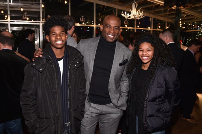 NEW YORK, NY - DECEMBER 14: (L-R) Shedeur Sanders, former football player Deion Sanders and Shelomi Sanders attend On Location Experiences' 51 Days To Super Bowl LI Celebration at STK Rooftop on December 14, 2016 in New York City. (Photo by Bryan Bedder/Getty Images for On Location Experiences)