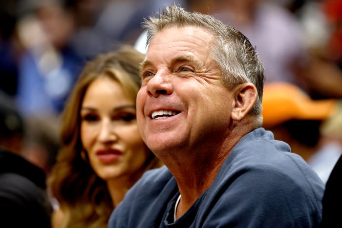 Former NFL head coach Sean Payton sitting courtside at an NBA game.