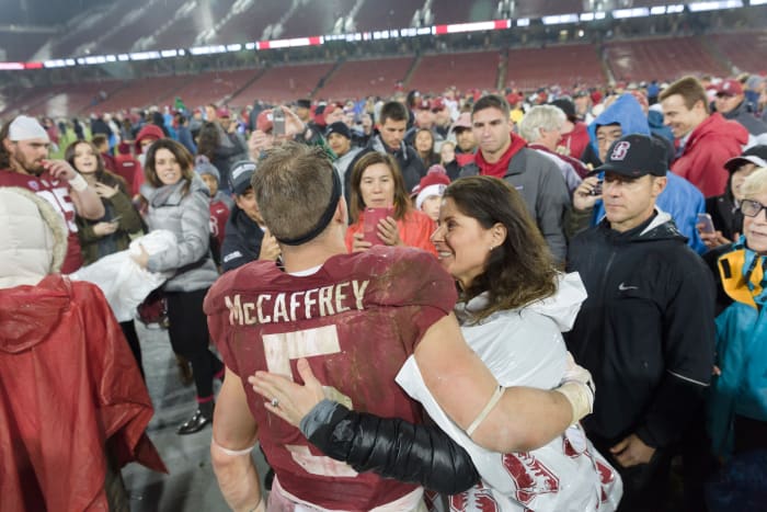 Christian McCaffrey hugs his mom Lisa following a Stanford football game.