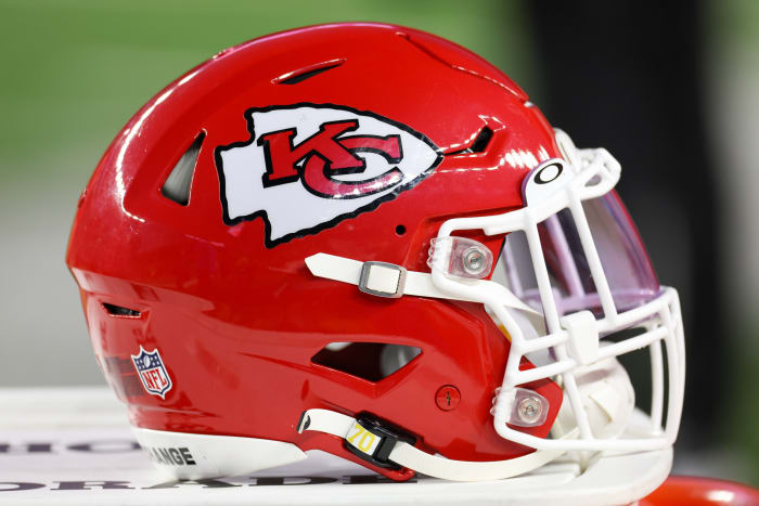 A Kansas City Chiefs helmet sits on the sidelines.