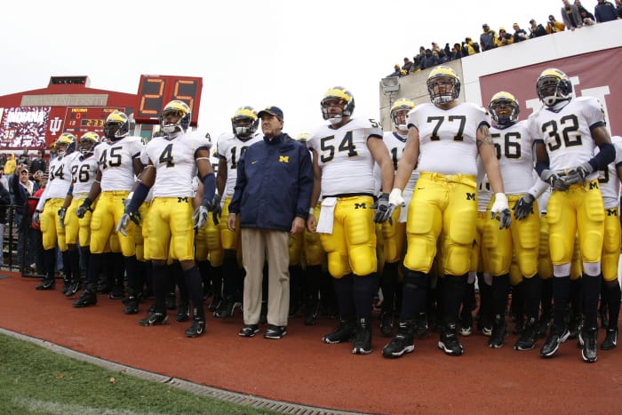 Michigan Wolverines head coach Lloyd Carr with his players before a game at Indiana.