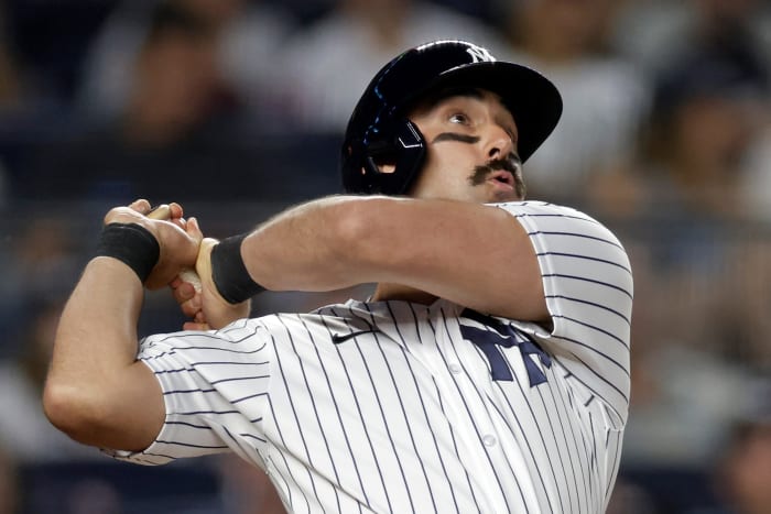 Matt Carpenter swinging a bat for the New York Yankees.