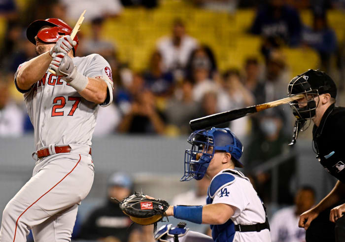 Los Angeles, CA - June 14: Home plate umpire Nate Tomlinson is hit in the face by a broken bat from Mike Trout #27 of the Los Angeles Angels as catcher Will Smith #16 of the Los Angeles Dodgers looks on in the ninth inning of a MLB baseball game at Dodger Stadium in Los Angeles on Tuesday, June 14, 2022. (Photo by Keith Birmingham/MediaNews Group/Pasadena Star-News via Getty Images)