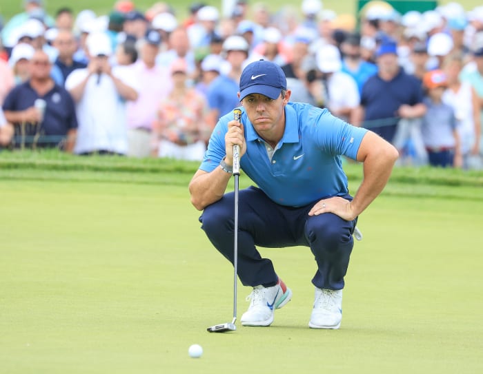 BROOKLINE, MASSACHUSETTS - JUNE 17: Rory McIlroy of Northern Ireland lines upa putt on the first hole during the second round of the 2022 U.S.Open Championship at The Country Club on June 17, 2022 in Brookline, Massachusetts. (Photo by David Cannon/Getty Images)