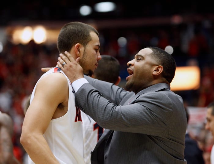 TUCSON, AZ - FEBRUARY 06: Assistant coach Book Richardson of the Arizona Wildcats talks to guard Gabe York #1 of the Wildcats during a time-out of a college basketball game against the Oregon Ducks at McKale Center on February 6, 2014 in Tucson, Arizona. (Photo by Ralph Freso/Getty Images)
