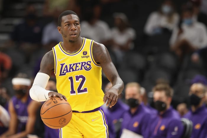 PHOENIX, ARIZONA - OCTOBER 06: Kendrick Nunn #12 of the Los Angeles Lakers handles the ball during the NBA preseason game at Footprint Center on October 06, 2021 in Phoenix, Arizona. The Suns defeated the Lakers 117-105. (Photo by Christian Petersen/Getty Images)