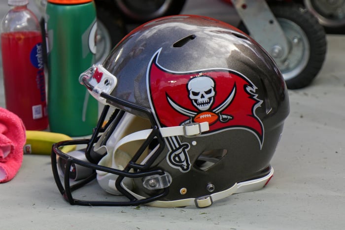 TAMPA, FL - JANUARY 16: Tampa Bay Buccaneers helmet sits on the field during the game between the Philadelphia Eagles and the Tampa Bay Buccaneers on January 16, 2022 at Raymond James Stadium in Tampa, FL.  (Photo by Andy Lewis/Icon Sportswire via Getty Images)