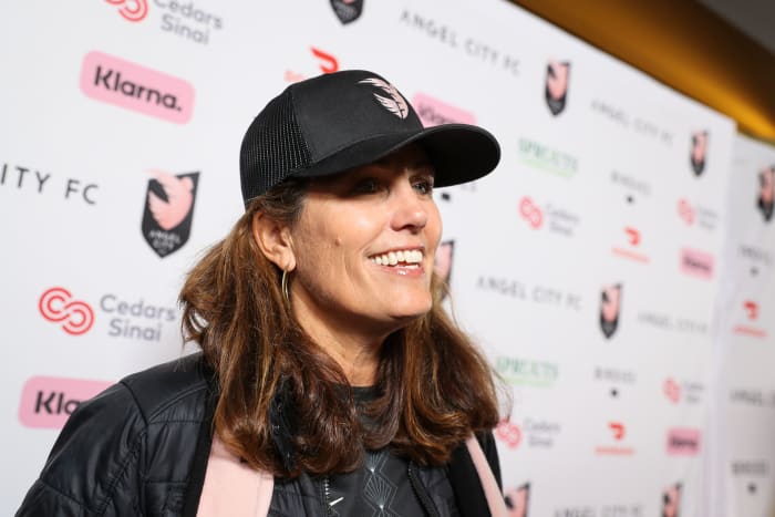 Julie Foudy speaks on the pink carpet before an Angel City FC game.