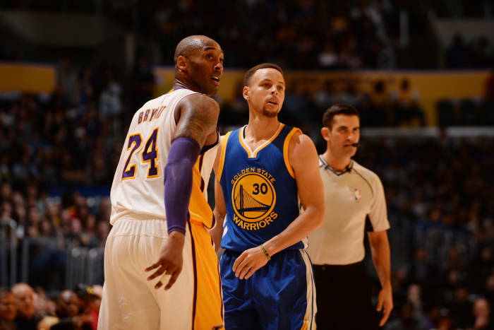 LOS ANGELES, CA - MARCH 6: Kobe Bryant #24 of the Los Angeles Lakers stands on the court against Stephen Curry #30 of the Golden State Warriors on March 6, 2016 at STAPLES Center in Los Angeles, California. NOTE TO USER: User expressly acknowledges and agrees that, by downloading and/or using this Photograph, user is consenting to the terms and conditions of the Getty Images License Agreement. Mandatory Copyright Notice: Copyright 2016 NBAE (Photo by Noah Graham/NBAE via Getty Images)