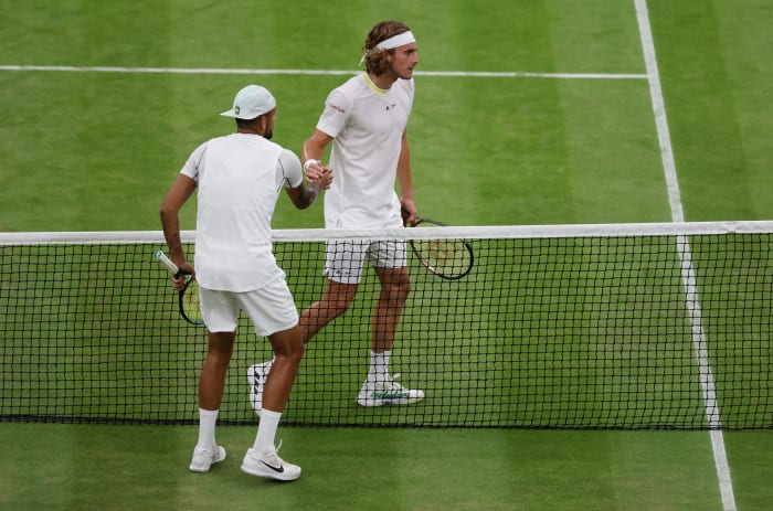 Nick Kyrgios and Stefanos Tsitsipas shaking hands.