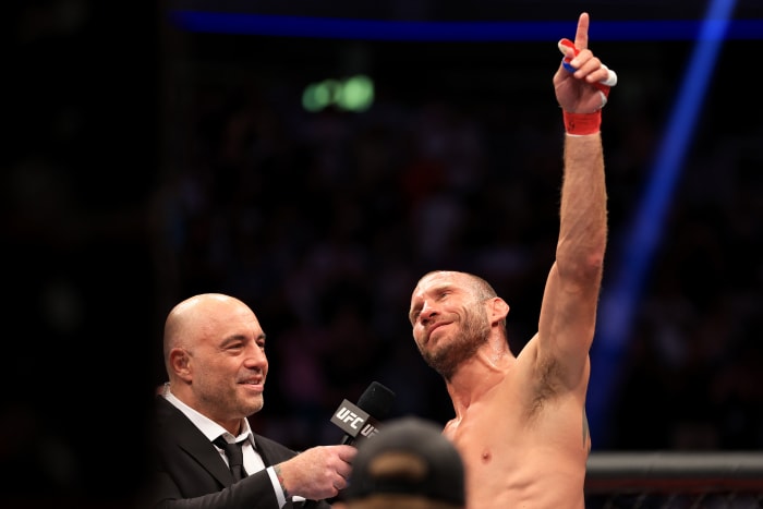 LAS VEGAS, NEVADA - JULY 02: Donald Cerrone (R) speaks with Joe Rogan as he announces his retirement after his welterweight bout against Jim Miller during UFC 276 at T-Mobile Arena on July 02, 2022 in Las Vegas, Nevada. Jim Miller won via a second round submission. (Photo by Carmen Mandato/Getty Images)