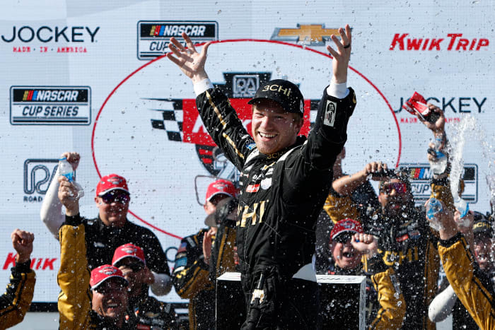 NASCAR driver celebrates winning the Kwik Trip 250.