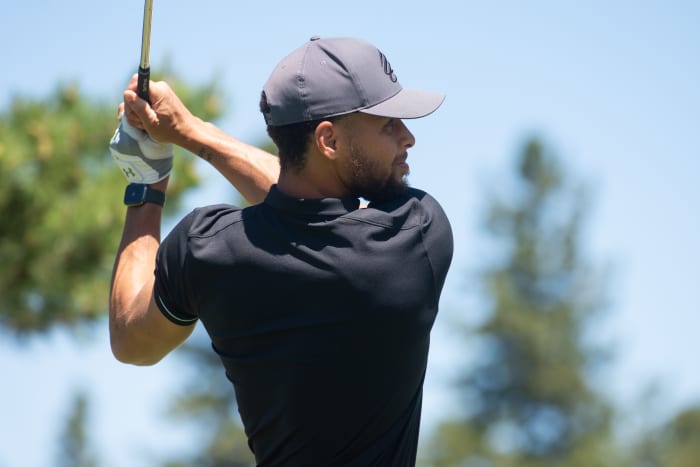 STATELINE, NV - JULY 6: Golden State Warrior Steph Curry tees off on the 10th hole during the first practice round at the ACC Golf Championship presented by American Century Investments on July 6, 2022 at Edgewood Tahoe Golf Course in Stateline, Nevada. (Photo by David Calvert/Getty Images for American Century Investments)