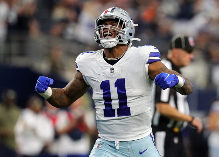 ARLINGTON, TEXAS - NOVEMBER 07: Micah Parsons #11 of the Dallas Cowboys celebrates after sacking Denver Broncos quarterback Teddy Bridgewater in the third quarter at AT&T Stadium on November 07, 2021 in Arlington, Texas.  (Photo by Richard Rodriguez/Getty Images)